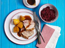 Roast pork with crackling, served with potatoes and red cabbage (Denmark)