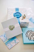 Gift boxes decorated with belt buckles and brooches