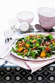 Rocket salad with roasted bacon and squash