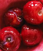 Glazed plums with liqueur and honey (seen from above)