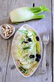 Fresh fennel with pears, black olives and toasted almonds