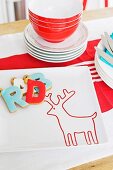 Letter-shaped biscuits on white plate with reindeer motif