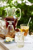 An Outdoor Ice Tea Stations with Simple Syrup, Lemons and a Pitcher of Tea