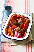 Marinated chicken with sweet potatoes, onions and peppers