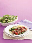 Lamb kebabs with lentil and spinach salad