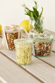 Three jars, containing mixes for lemon risotto, African lentil soup and bean soup