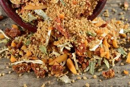 Couscous and ingredients in front of an overturned bowl