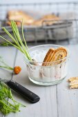 Pastry whirls in a bowl with garlic dip