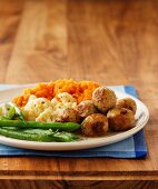 Meatballs with mashed sweet potato and vegetables