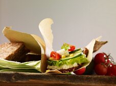 Wholegrain bread sandwich filled with cottage cheese, cucumber, tomatoes and sweetcorn