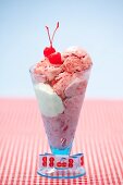 Strawberry ice cream with cocktail cherries