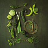 An arrangement of green vegetables and herbs