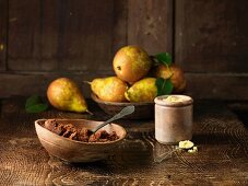 Pears and spiced muscovado sugar and molasses on rustic wooden surface