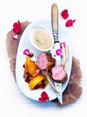 Rack of lamb with aromatic cardamom & espresso caramel sauce and peaches
