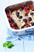 Baked mackerel with cherry tomatoes and olives
