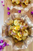 Potato salad with pickled gherkins, onions, mustard and chives for New Year