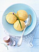 Three potato dumplings with chives