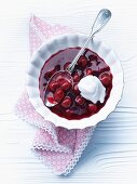 Chilled sour cherry soup with a blob of cream