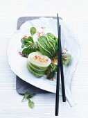 Stuffed rolled lettuce leaves with lamb's lettuce and a peanut sauce (China)