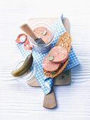 Liver pâté, seeded bread roll and pickled gherkins