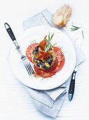 Eggplant-zucchini towers on tomato carpaccio