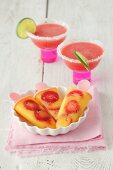 Mango-strawberry popsicles and strawberry margaritas