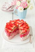 Strawberry ice cream cake with strawberry sorbet and nuts
