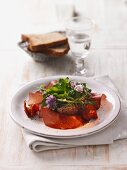 Raw ham with rolls and herb salad