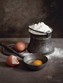 Eggs and flour in a rustic setting