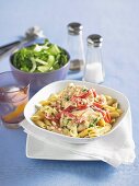 Penne with chicken breast and thinly sliced peppers in cream sauce