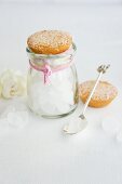 Flavoured rock candy in a jar with a coconut cake as a lid