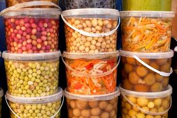 Pickled vegetables in plastic buckets at the market