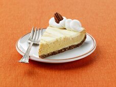 A Slice of Marbled Pumpkin Cheesecake with Gingersnap Cookie Crust