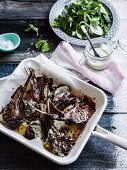 Lamb chops with lemon and fennel served with a pea and peppermint salad