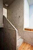 Concrete and pale wood stairwell