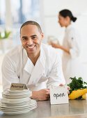 Two chefs preparing food in their restaurant