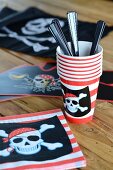 Napkins and cups for a pirate party