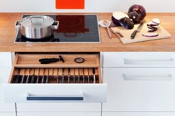 A knife draw beneath the hob in the kitchen