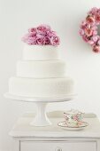 Classic Stack Cake with Fondant details and Pink Roses