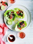 Lettuce leaves filled with chopped pork, watermelon and bean sprouts