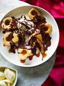 Baked pears with chocolate sauce and vanilla ice cream