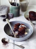 A chocolate fondant pudding with cream