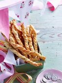 Twisted pastry sticks filled with Parmesan and spring onions