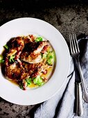 Spring chicken with a mustard crust, savoy cabbage and a pepper sauce