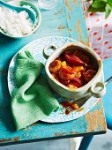 Sweet and sour pork meatballs with pineapple and red onions served with rice