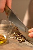 Caraway seeds being chopped