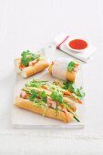 Baguette sandwiches with roast pork, julienne vegetables and coriander