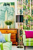Contemporary painting on Biedermeier chest of drawers, striped sofas and curtain in bright shades of red and green