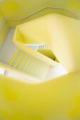 Yellow walls in freeform stairwell