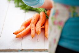 A bunch of carrots on wooden planks